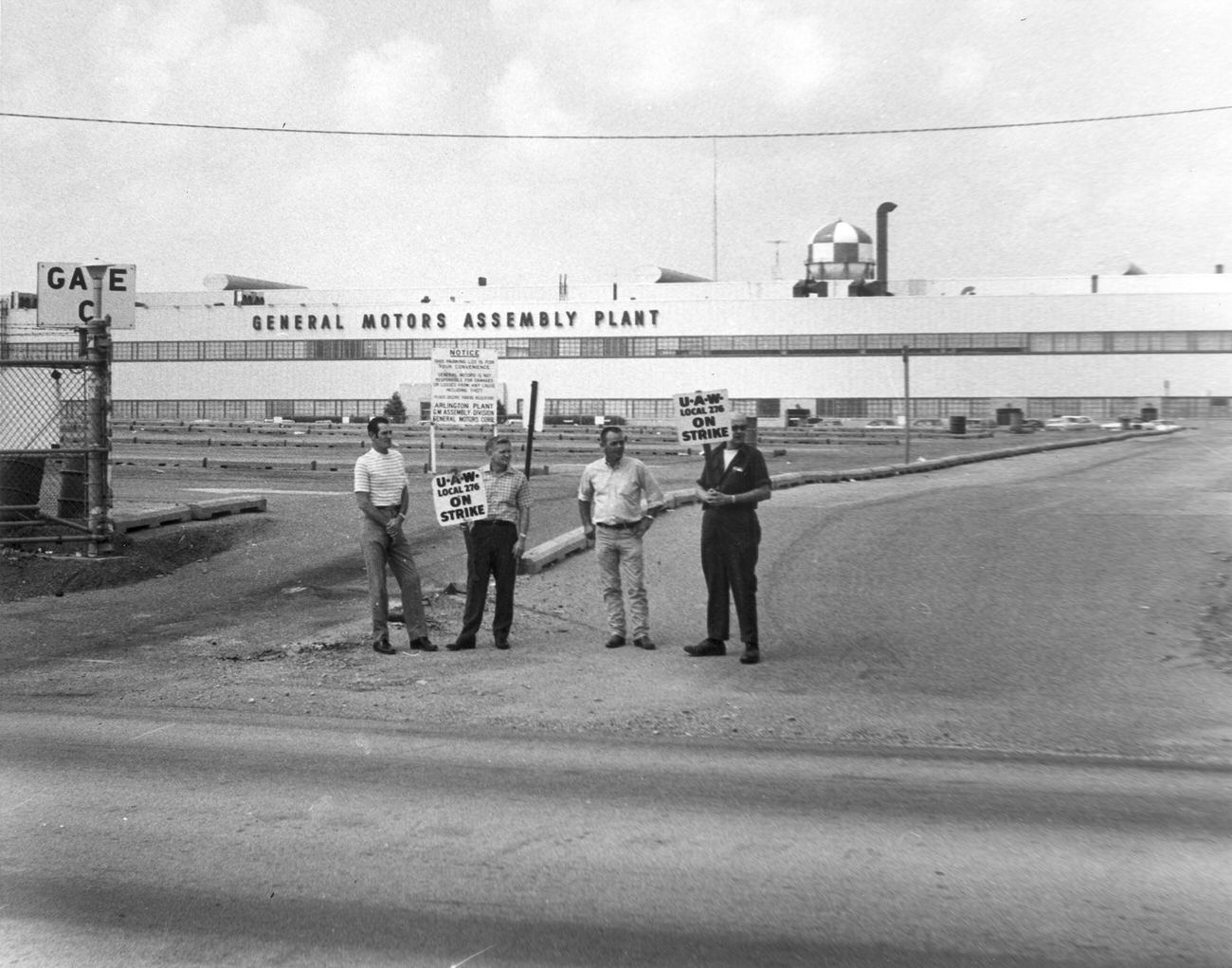 Four men from United Auto Workers (U. A. W.) Local 276 on strike in front of General Motors Assembly Plant, 1970