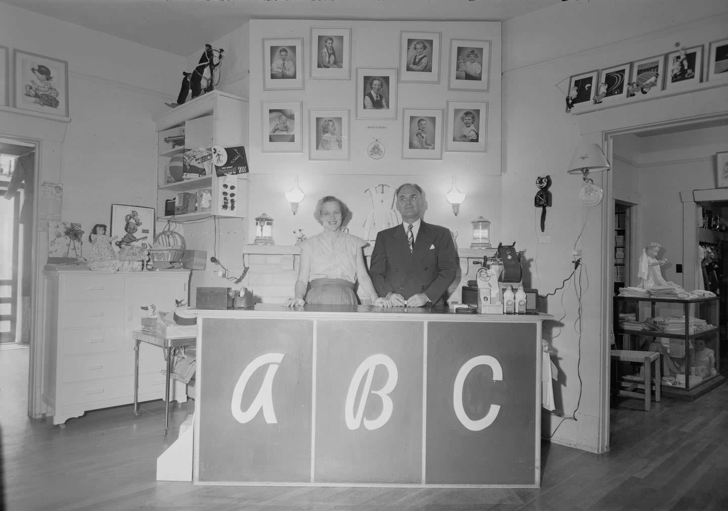 Eve Marie Martin and George Martin stand behind the counter in the ABC shop, located at 809 W. 12th St. in Austin, 1951