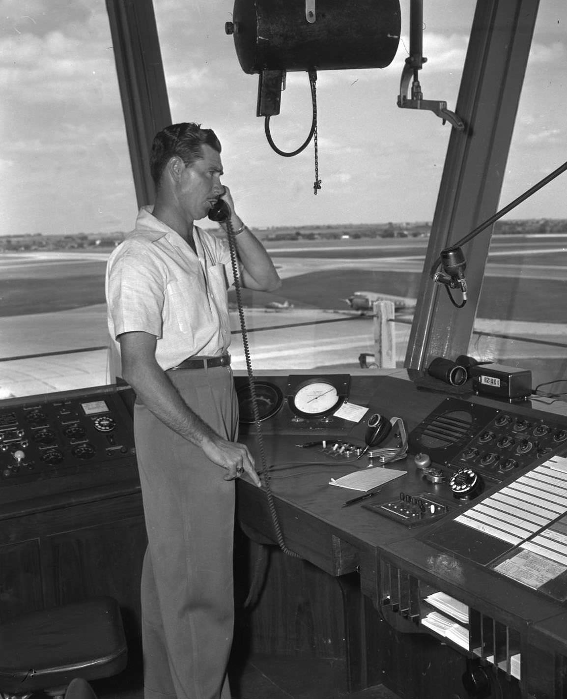 Airport scenes: control tower, planes, 1950