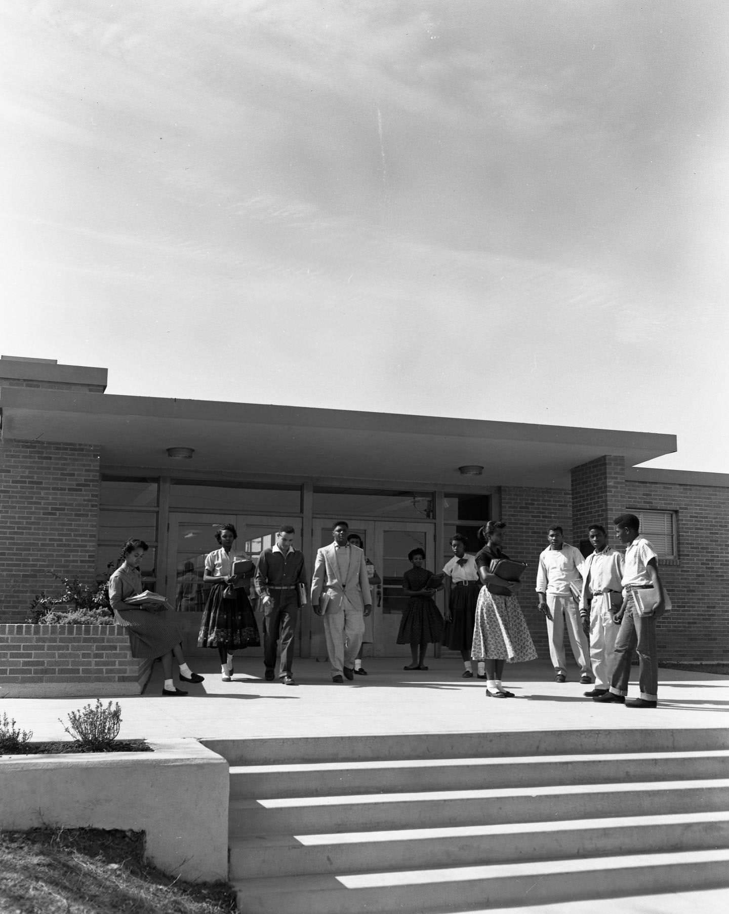 A group of students outside the entrance to Anderson High School, 1956