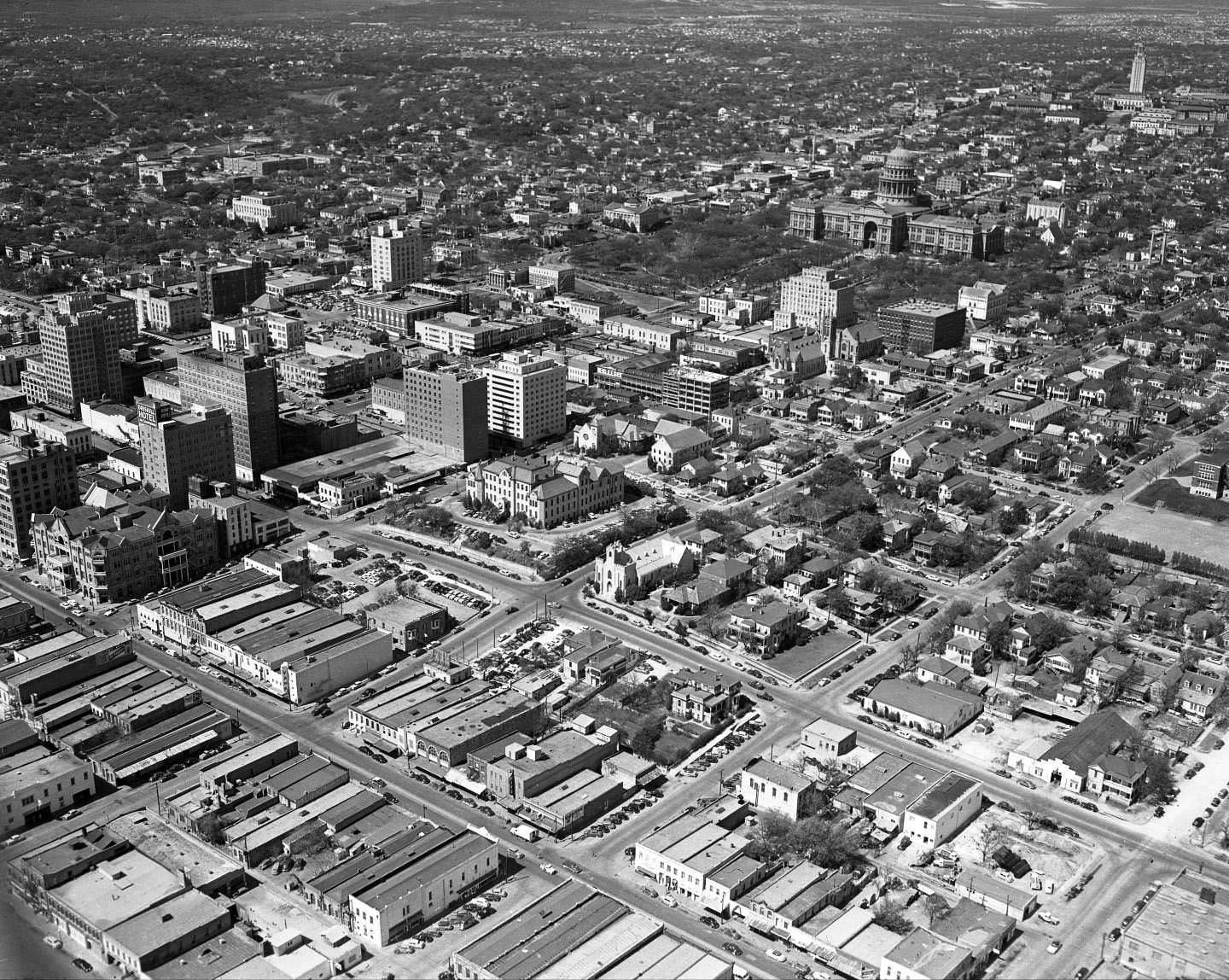 From the southeast of the State Capitol, an aerial shot of downtown Austin, The Driskill, Captiol and UT Tower all in view, 1959