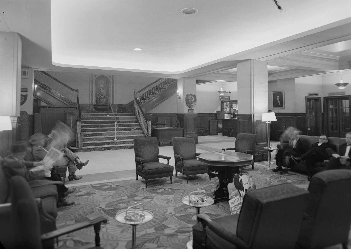 Interior of the Austin Hotel showing the lounge with unidentified guests of the hotel, 1954