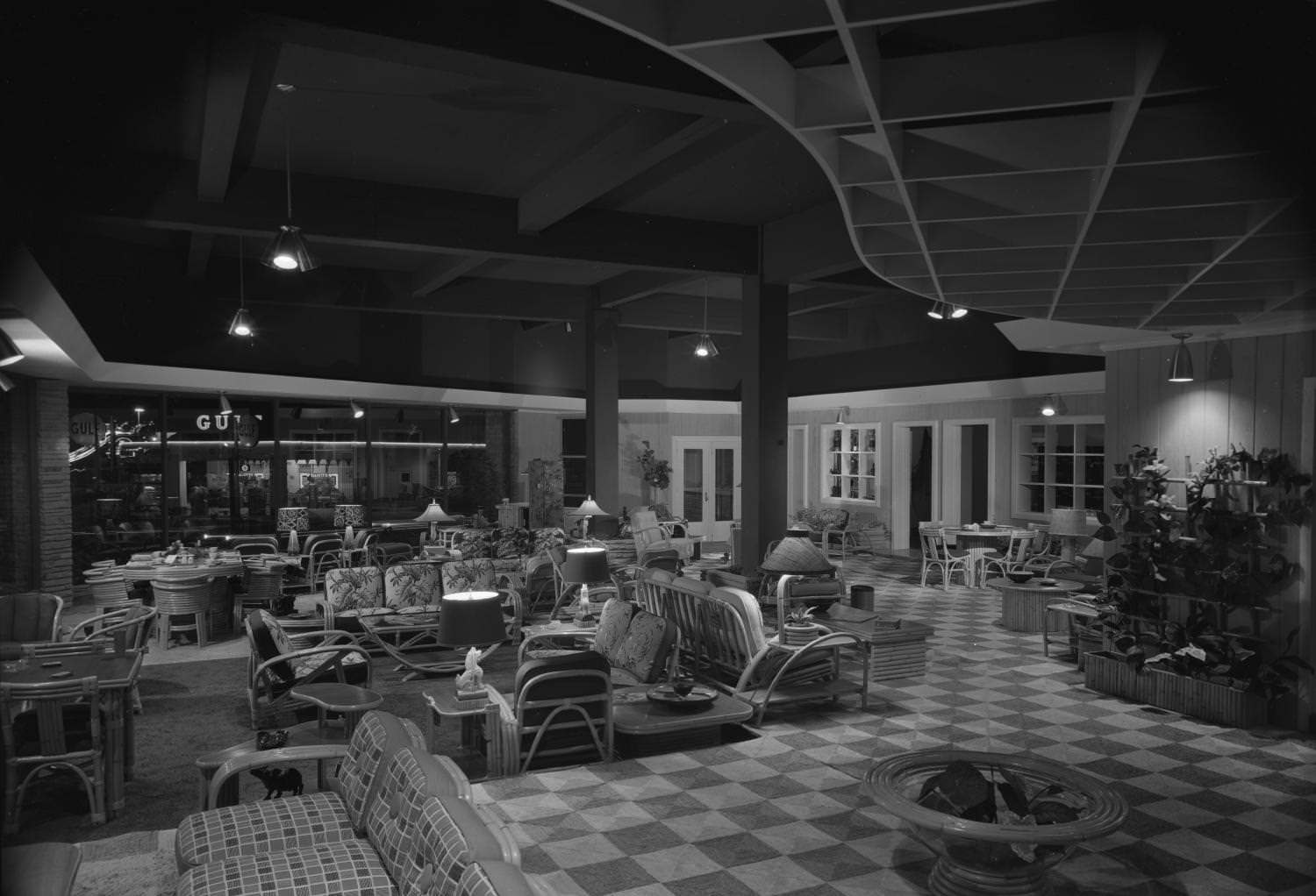 The Austin Tropic Shop furniture store. There are numerous types of rattan furniture on display, 1950