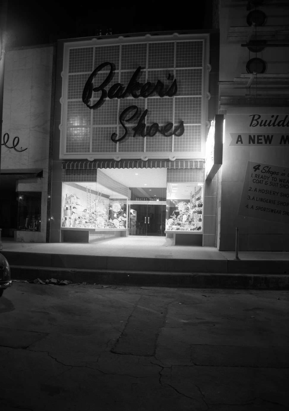 View of Baker's Shoe Store with show windows. Baker's Shoe Store was located at 708 Congress, 1950
