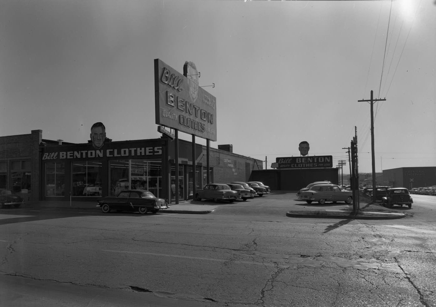Exterior view of Bill Benton's Men's Clothing Store which was located at 309 W. 5th Street, 1955