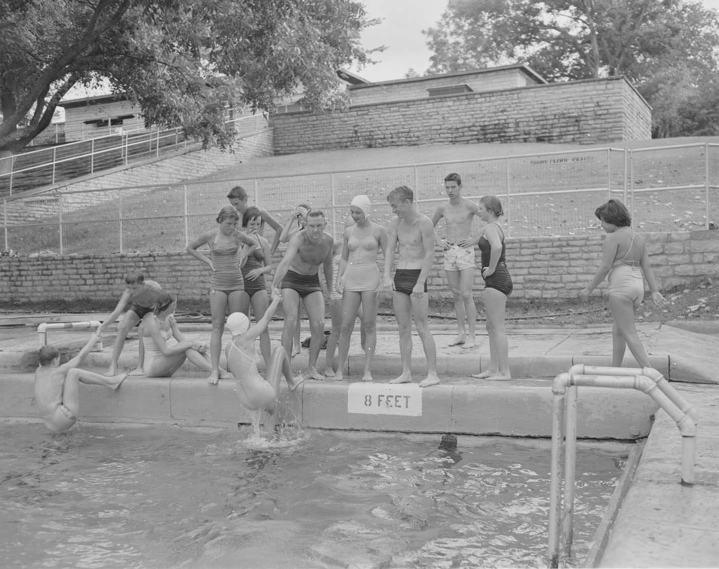 Boys and girls standing at edge of Deep Eddy Pool, 1953