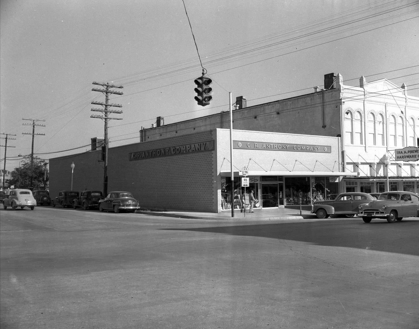 C.R. Anthony Co. and Ira A. Prewitt Hardware buildings on street corner, 1950