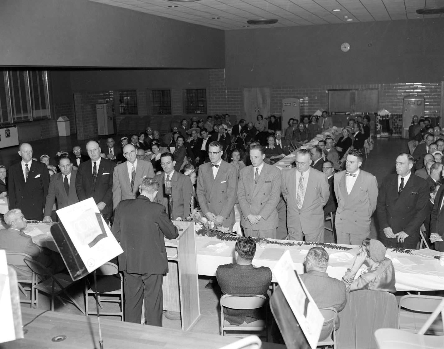 Men and women of the South Austin Civic Club meet for an unknown event, 1955
