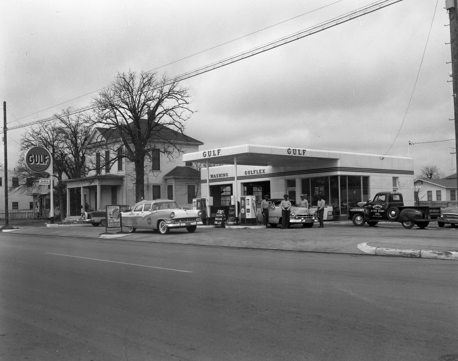 Anderson's Gulf Service Station and crew located on the 1700 block of East 12th Street, 1956