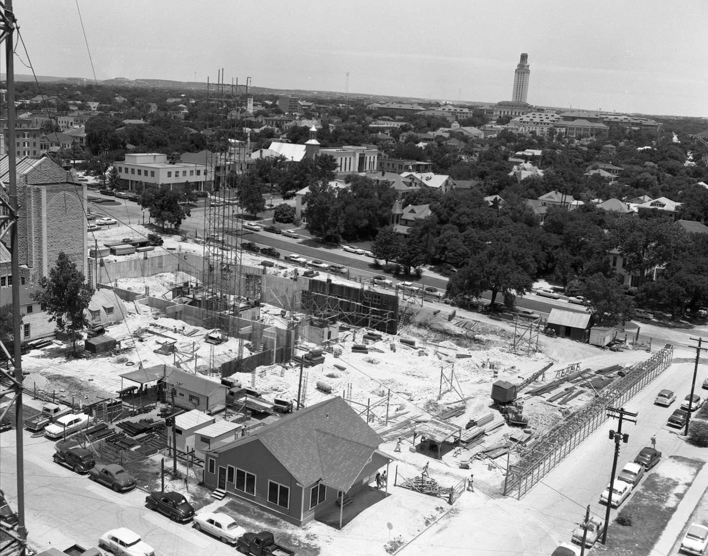 Aerial shot of cranes and scaffolding at TEC construction site. 15th Street, 1958