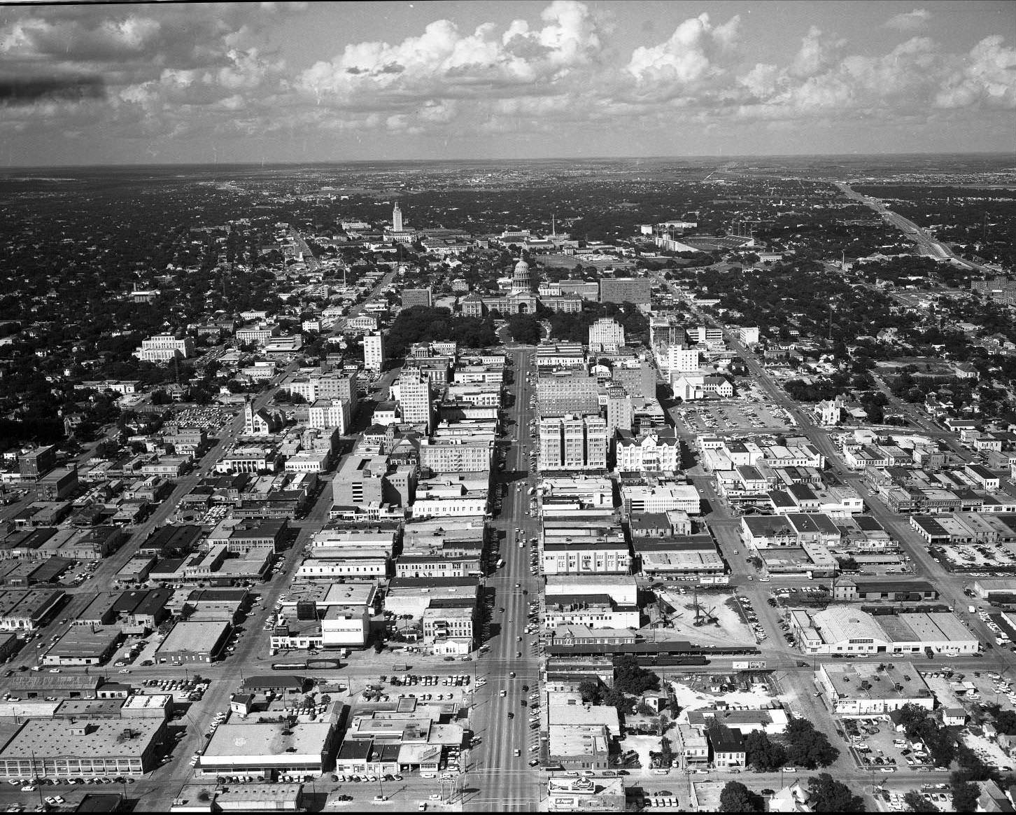 Aerial shot directly south of Capitol, (farther back) and Austin north of the Colorado River, 1959