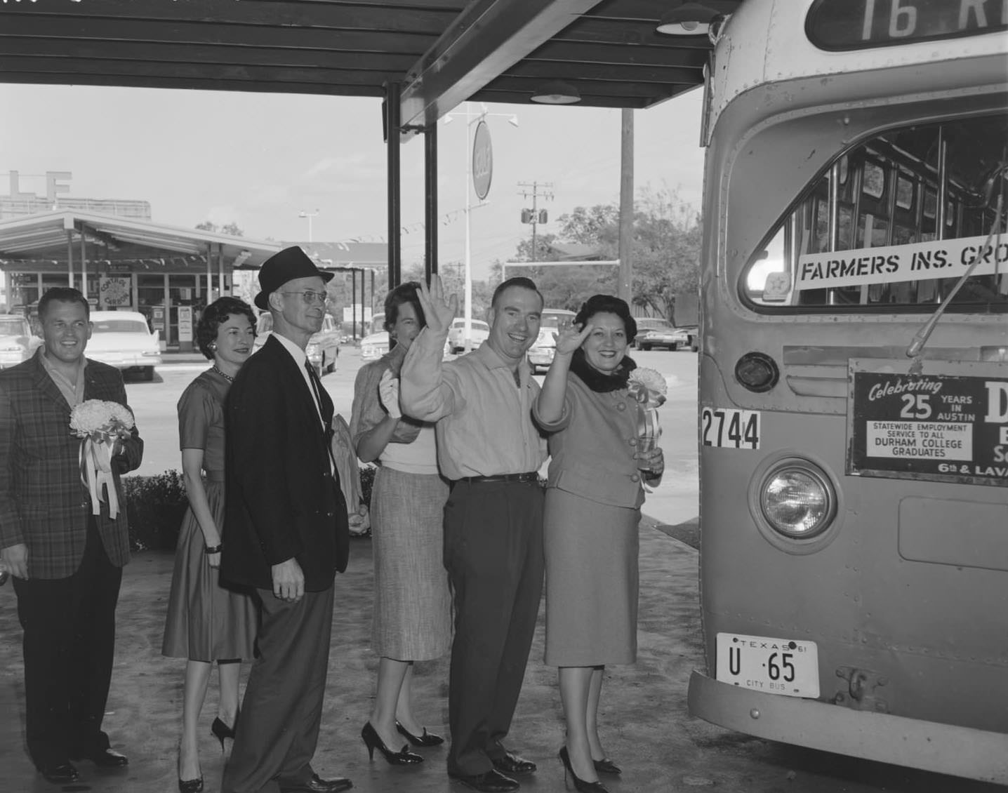 A group of people boarding a bus for a Friday night cocktail party.1961.