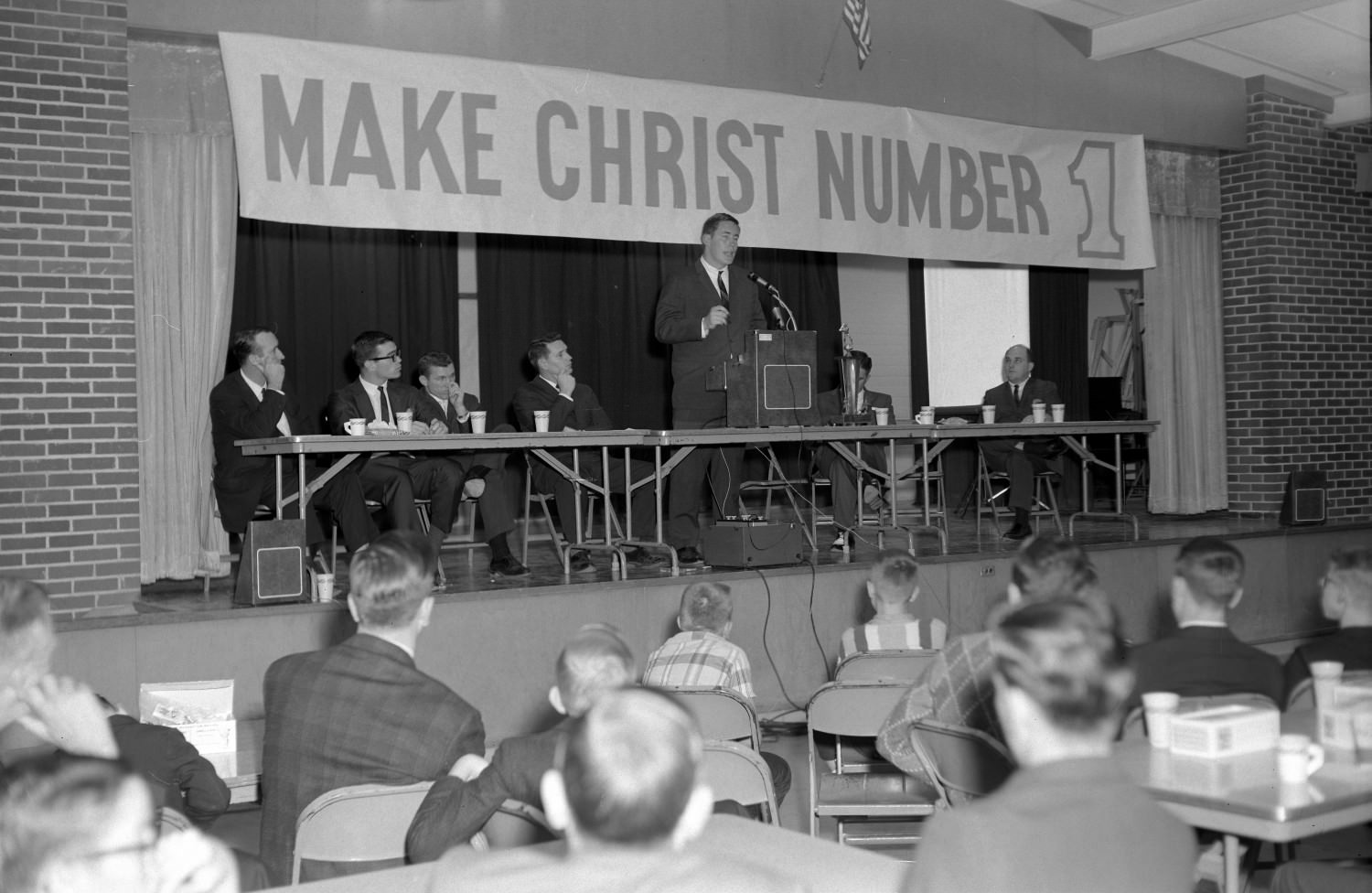 Unidentified man giving speech in the Fellowship Hall at Hyde Park Baptist Church, Austin, 1966