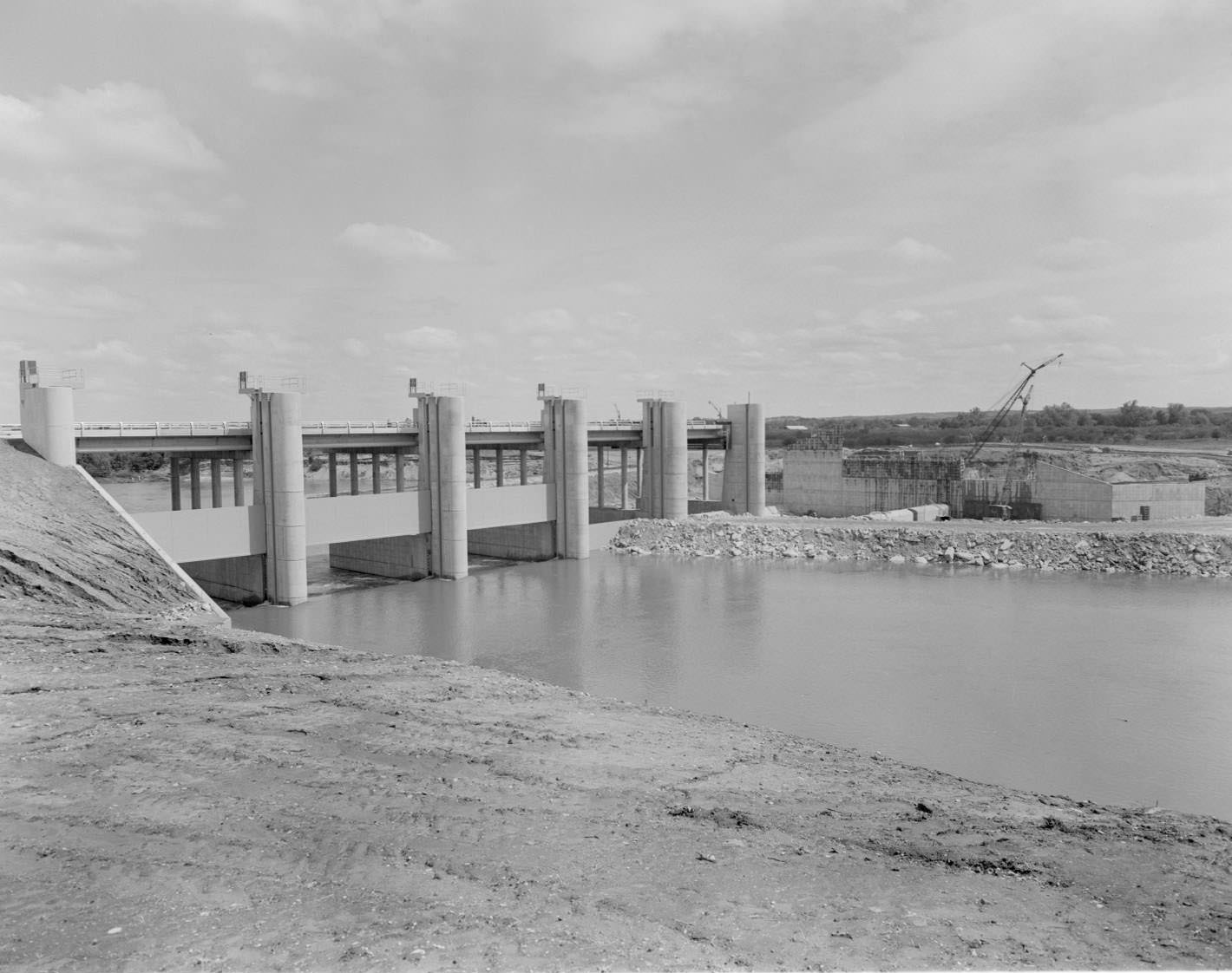 Longhorn Dam, looking southwest, Austin, 1966. Pleasant Valley Rd. crosses the dam which was built to provide water for Holly Street power plant.