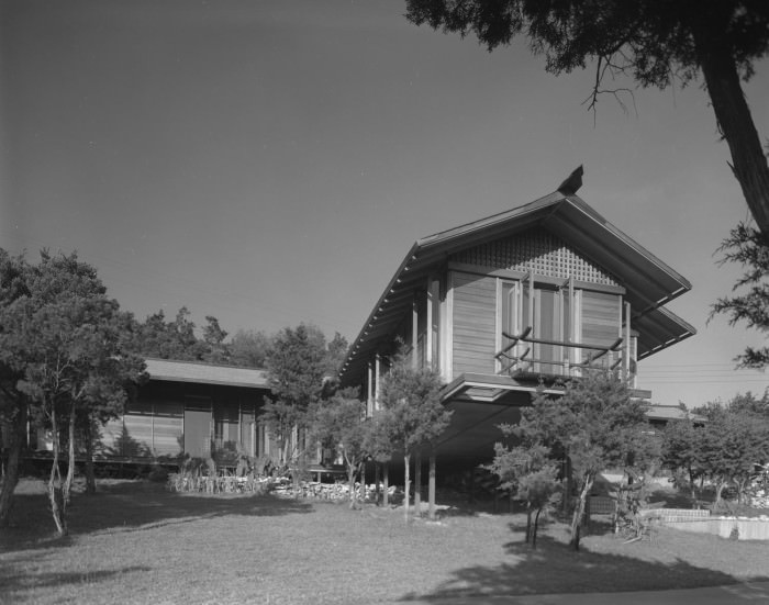 The exterior of a home perched on a hillside, Austin, 1961