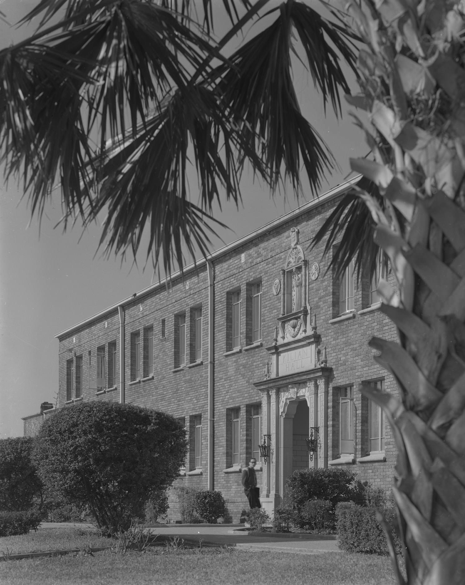 The exterior of a decorative stone and brick building at Concordia Lutheran College, located at 3400 East Avenue, Austin, 1961