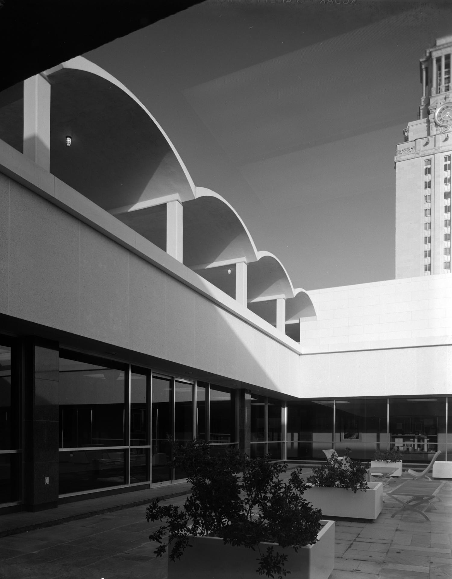 The roof courtyard of the Peter T. Flawn Academic Center. The UT Tower is visible on the right side, 1964