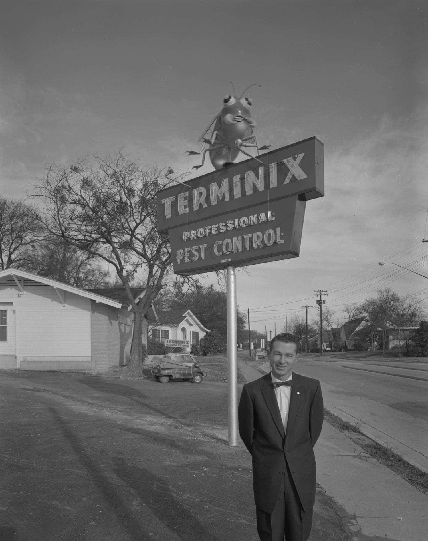 Bill Youngblood in Front of Terminix Sign, 1961.