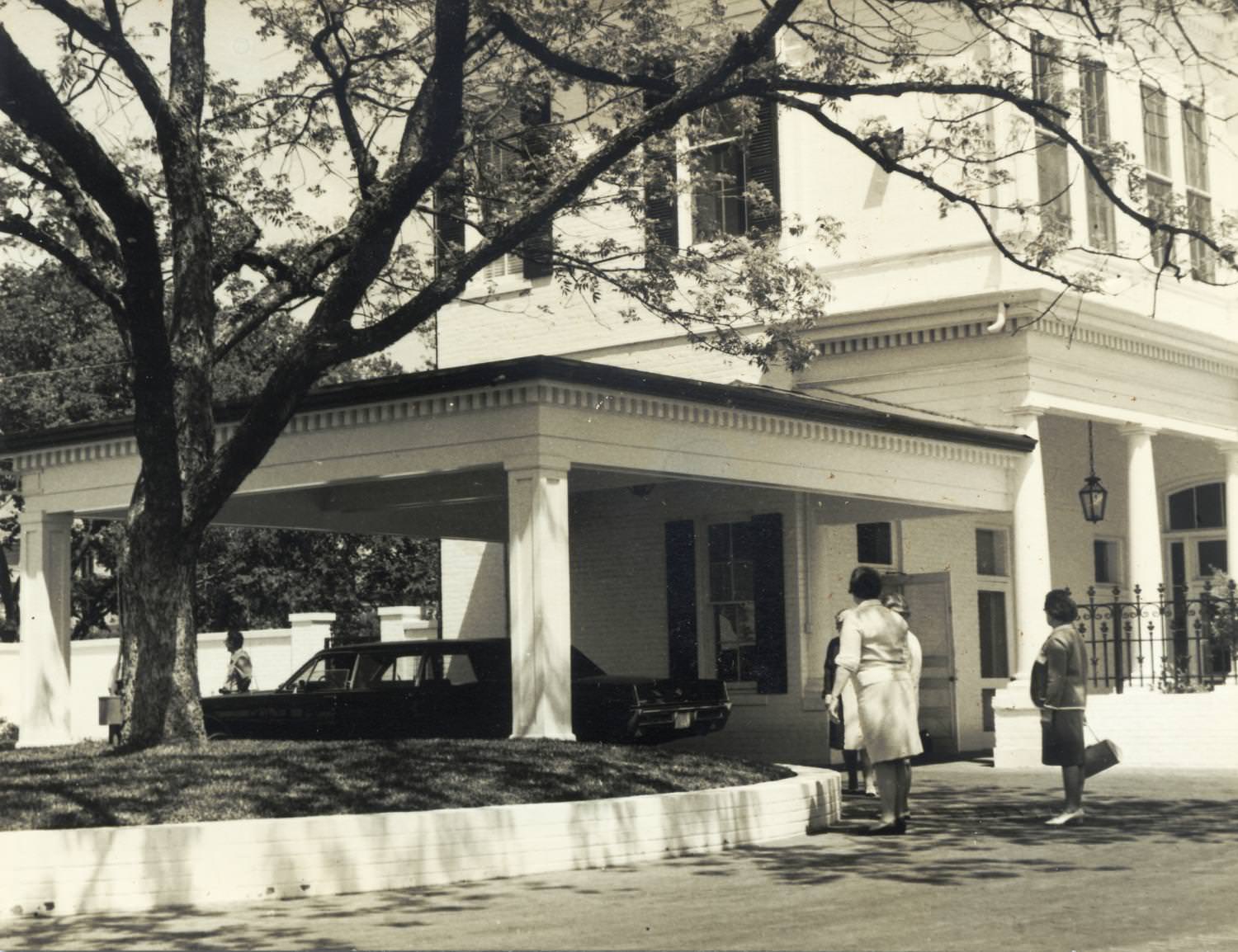 Texas Governor's mansion with limousine underneath attached carport, 1965