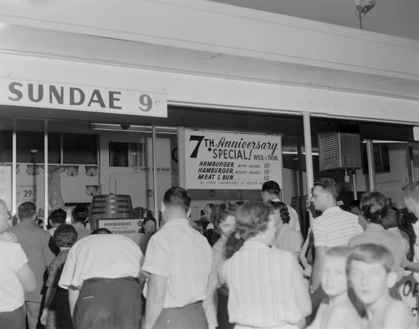 Customers standing in front of Kentucky Fried Chicken stand, Austin, 1960