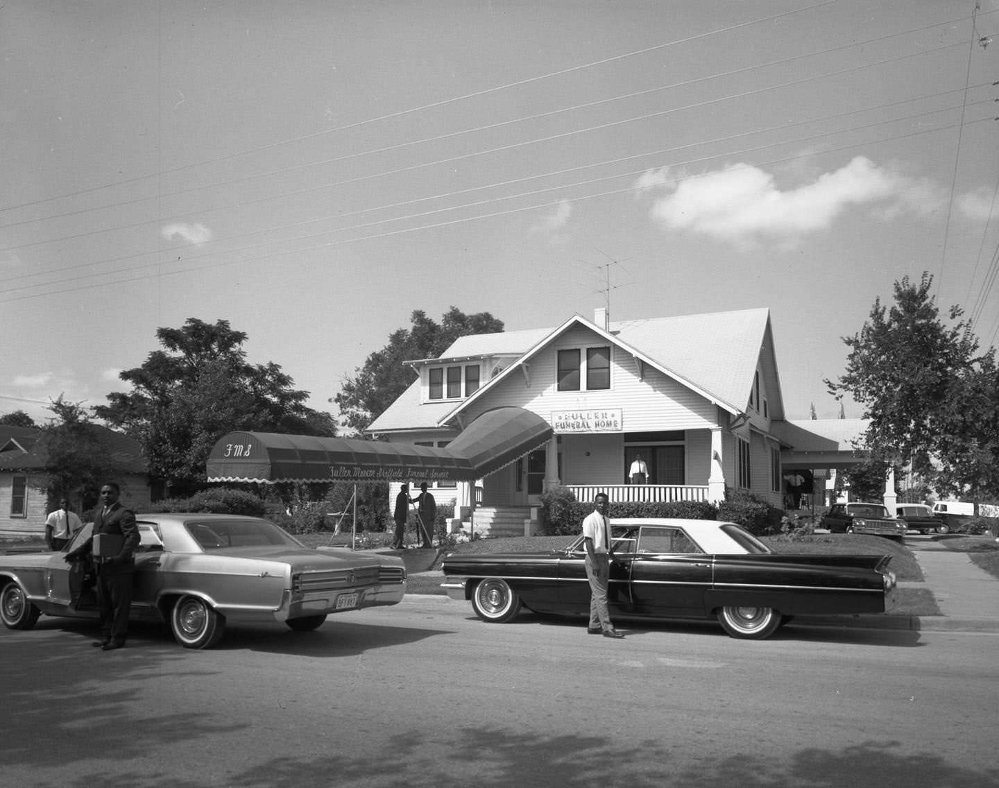 Direct head on exterior shot of funeral home, 1164 Angelina St., Austin, 1964