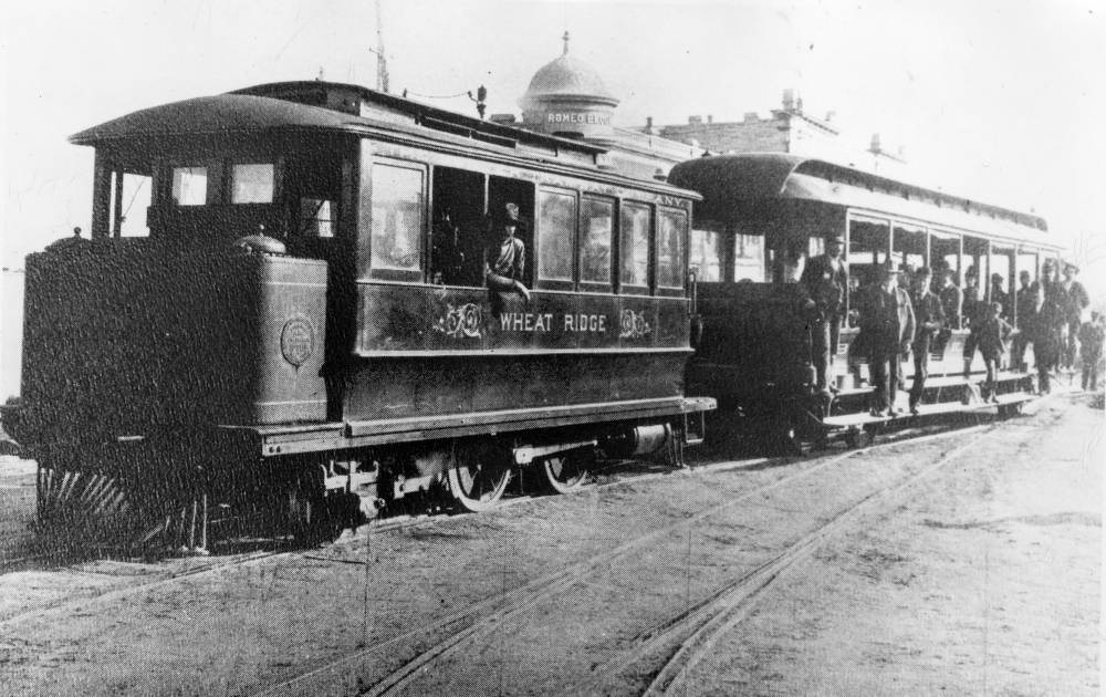 Men and boys pose on the Denver City Tramway Company 'Steam Dummy' steam-powered street car at 30th (Thirtieth) Avenue and Zuni Street in the Highland neighborhood of Denver, 1900.