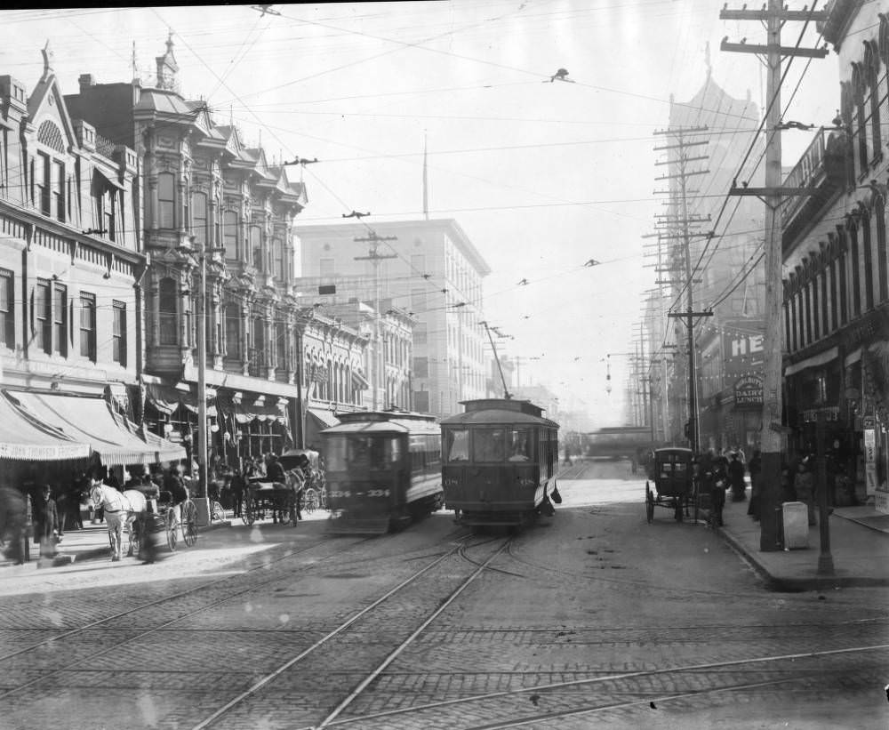 Denver Tramway Company trolleys number 334 and 68 on 15th (Fifteenth) Street at Lawrence Street in Denver, 1905