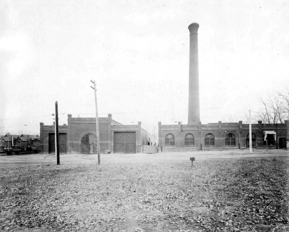 Denver Tramway Company garage, Leyden Coal Co. coal wagons, and a building with smokestack at 38th (Thirty-eighth) Avenue in Denver, 1905