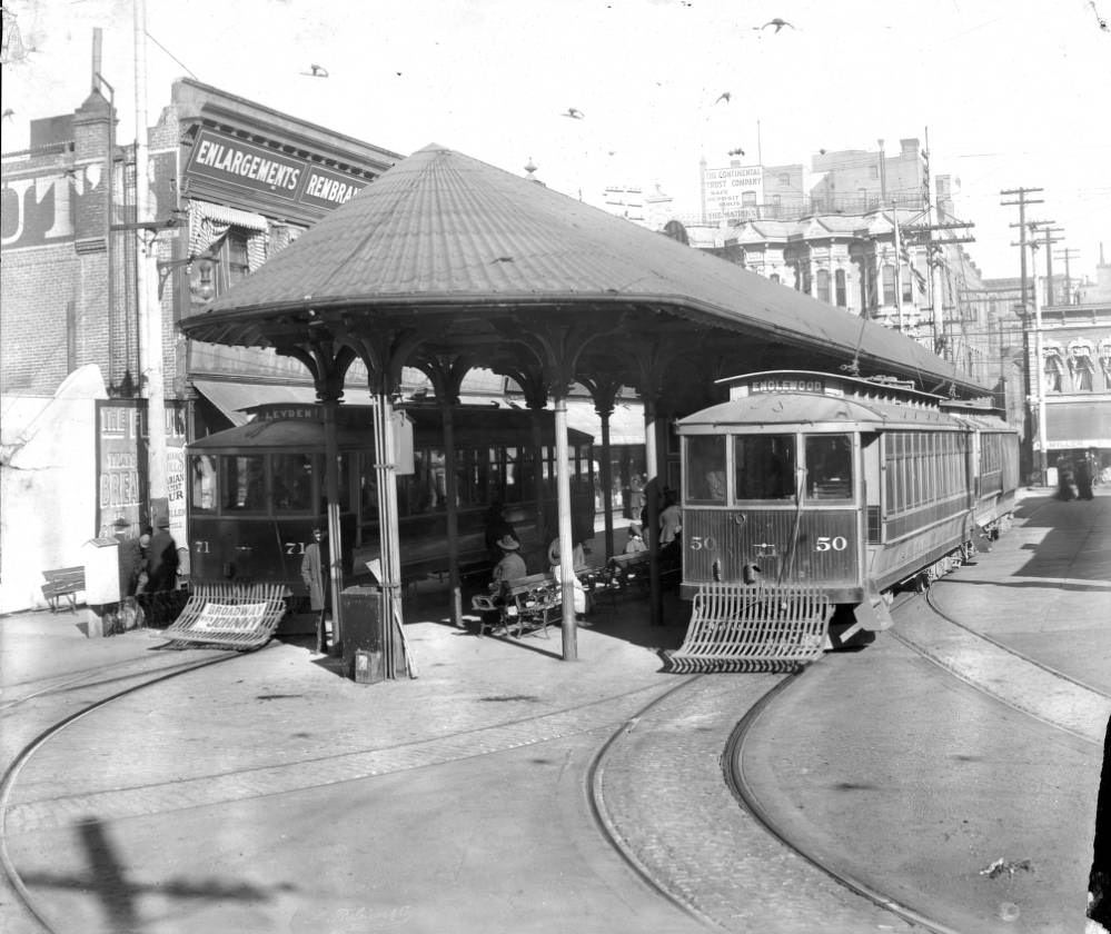 Denver Tramway Company trolley cars Englewood number 50 and Leyden number 71 are parked at a covered stop on 15th (Fifteenth) Street in Denver, 1905