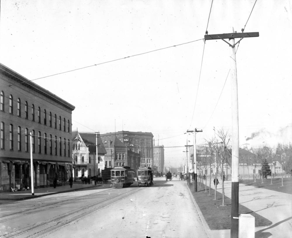 View of Denver Tramway Company trolleys number 166 and 53 on Colfax Street at Broadway in Denver, 1900