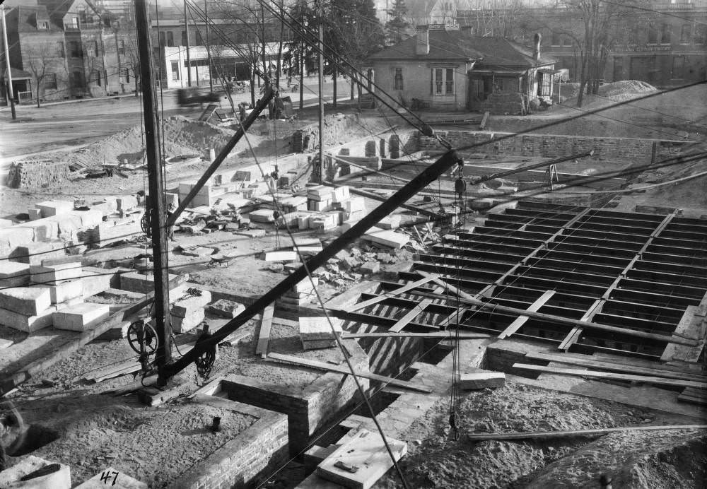 Denver Public Library (Carnegie) construction consists of basement and foundation walls and a crane in Denver, 1907