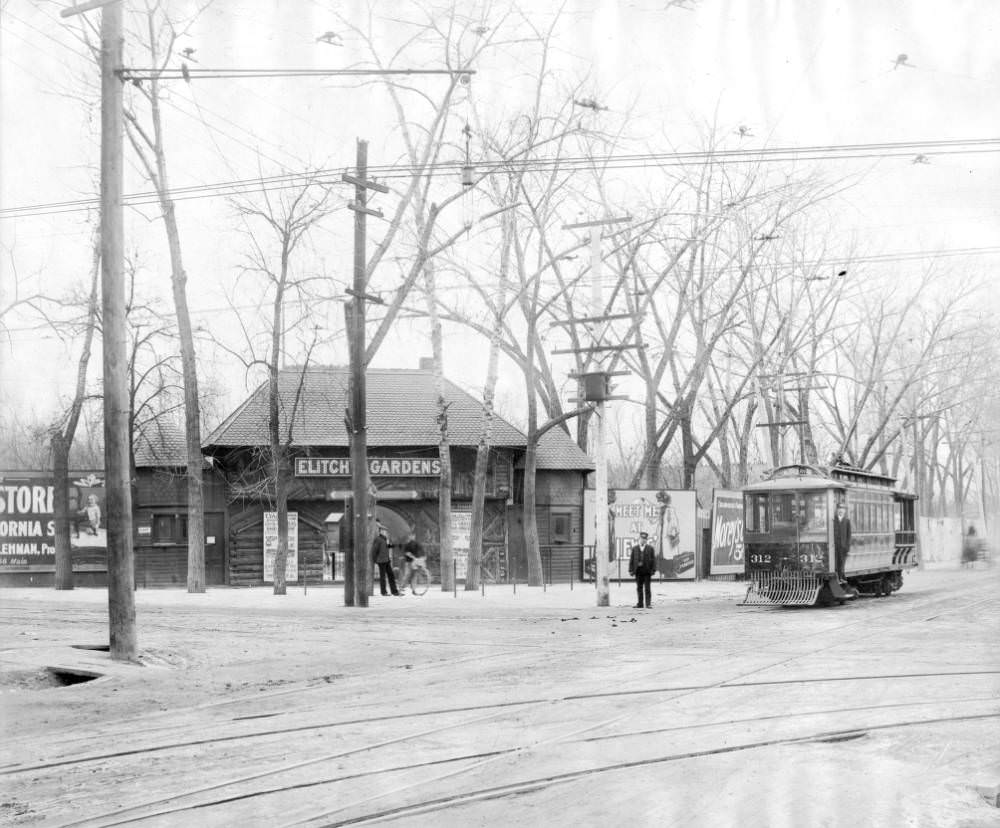 Conductors pose with Denver Tramway Company trolley West 38th (Thirty-eighth) Avenue number 312 at the entrance to Elitch Gardens in Denver, 1905