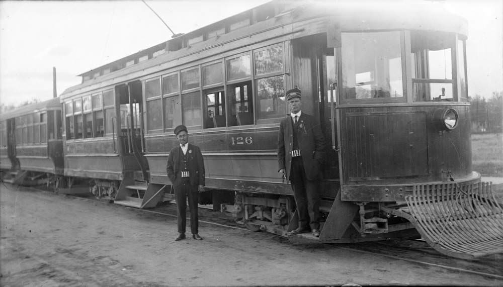 View of Denver Tramway Company car number 126 and a 500-series trailer (South Pearl Street Line), and men in conductor uniforms, in Denver, 1909