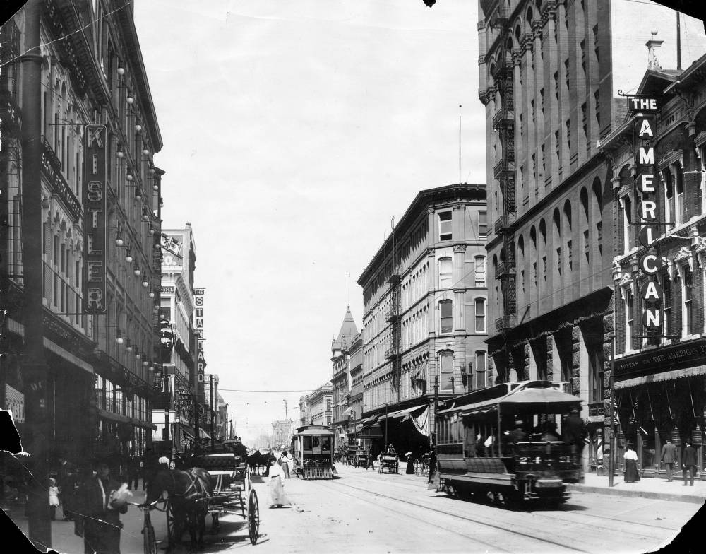 View of 16th (Sixteenth) Street in Denver, Colorado; shows pedestrians, traffic, Denver, 1900s