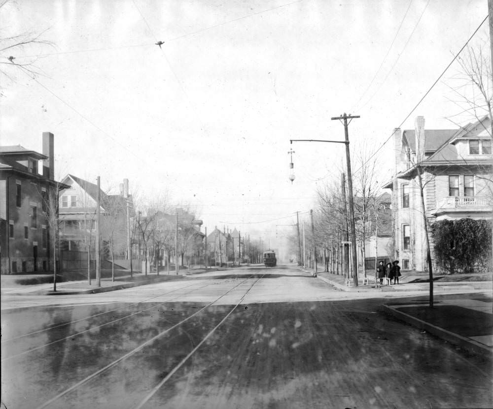 Denver Tramway Company trolley number 200 rides past houses on 17th (Seventeenth) Avenue in Denver, 1900