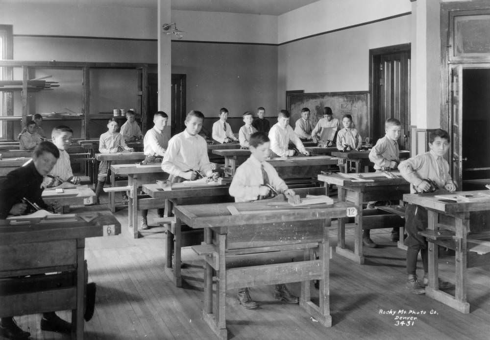 Boys pose with wood planes in the workshop at the Denver Orphans' Home (later the Denver Children's Home) at 1501 Albion Street in the South Park Hill neighborhood of Denver, 1909