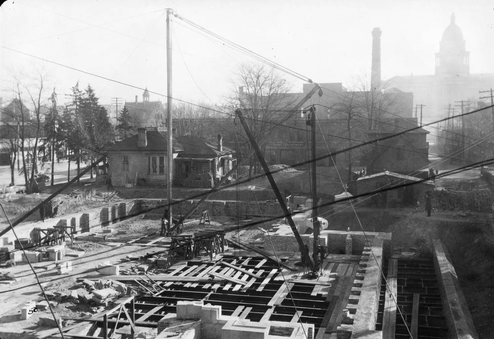 Denver Public Library (Carnegie) construction consists of basement and foundation walls and cranes in Denver, 1907