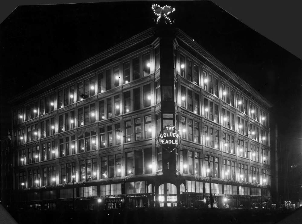 Night view of the Golden Eagle Dry Goods Store, at 16th (Sixteenth) and Lawrence Streets, in Denver, 1900