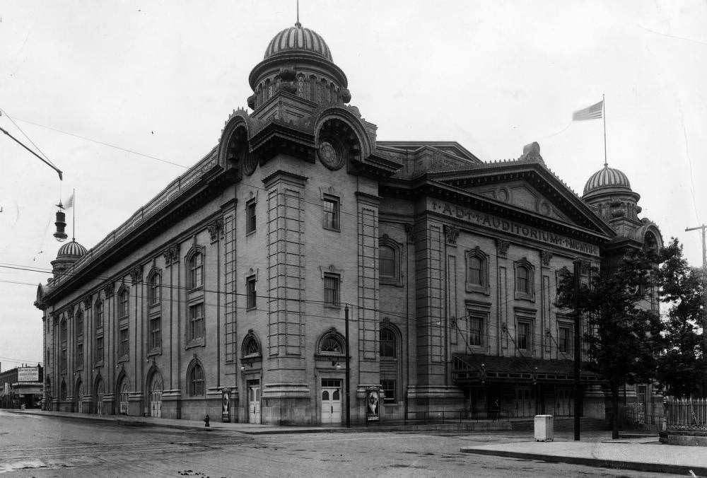 Denver Municipal Auditorium in Denver, Colorado; shows a stone building with domes and entablature, 1908