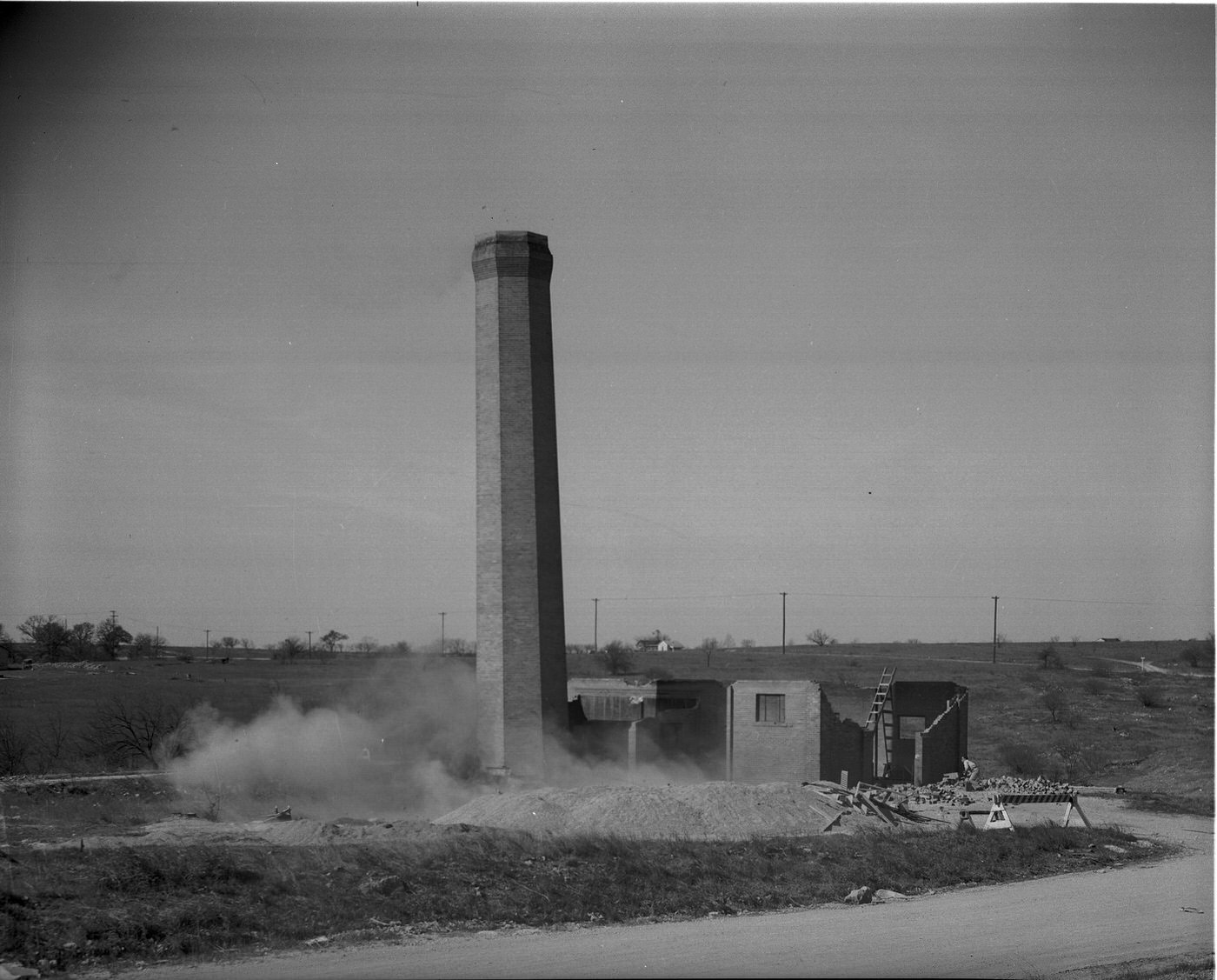 The Arlington Heights landmark demolition of a 75 foot incinerator, 1948