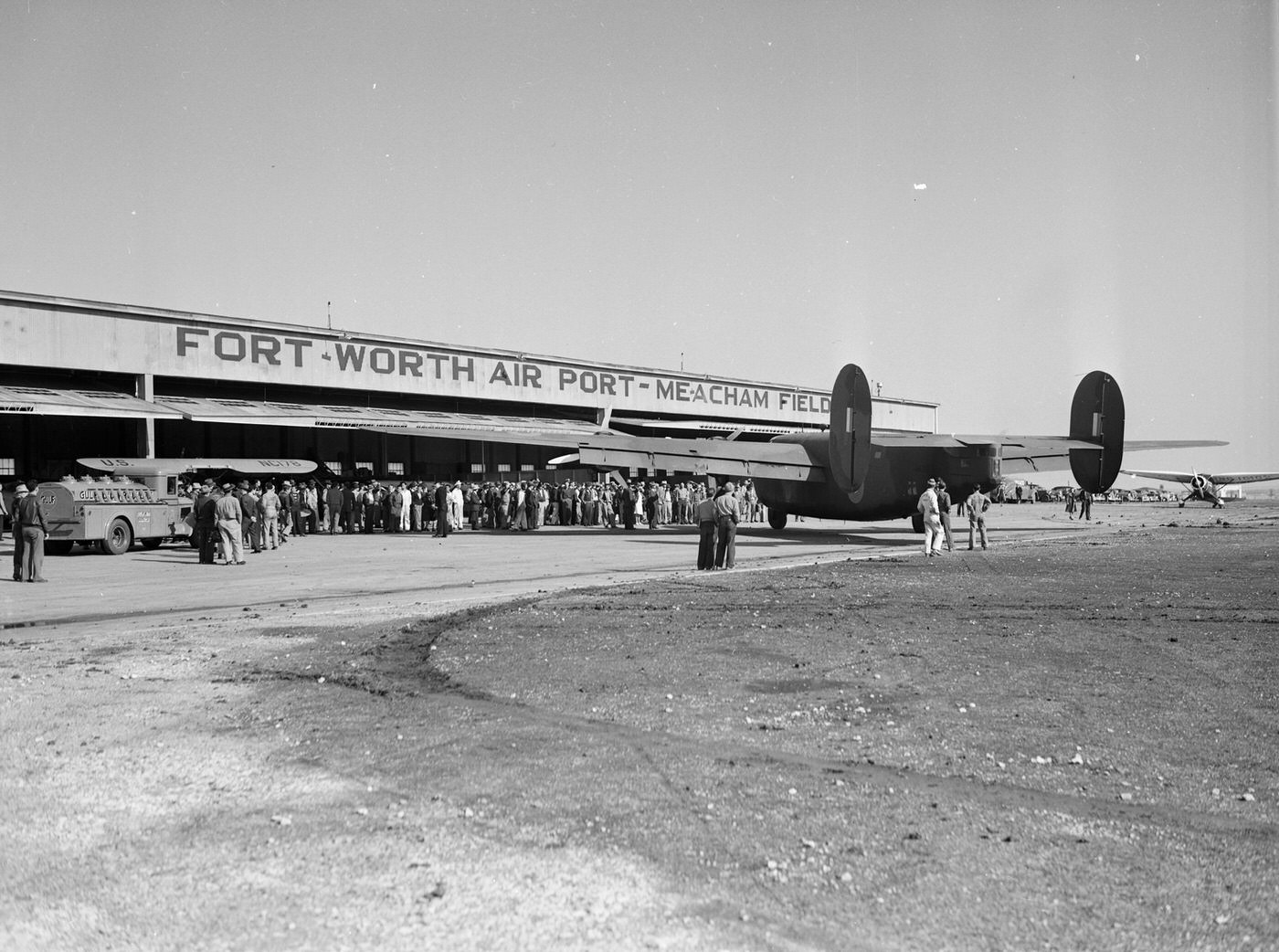 Crowd around Consolidated Aircraft 30-ton land bomber at Meacham Field, Fort Worth, Texas, 1941