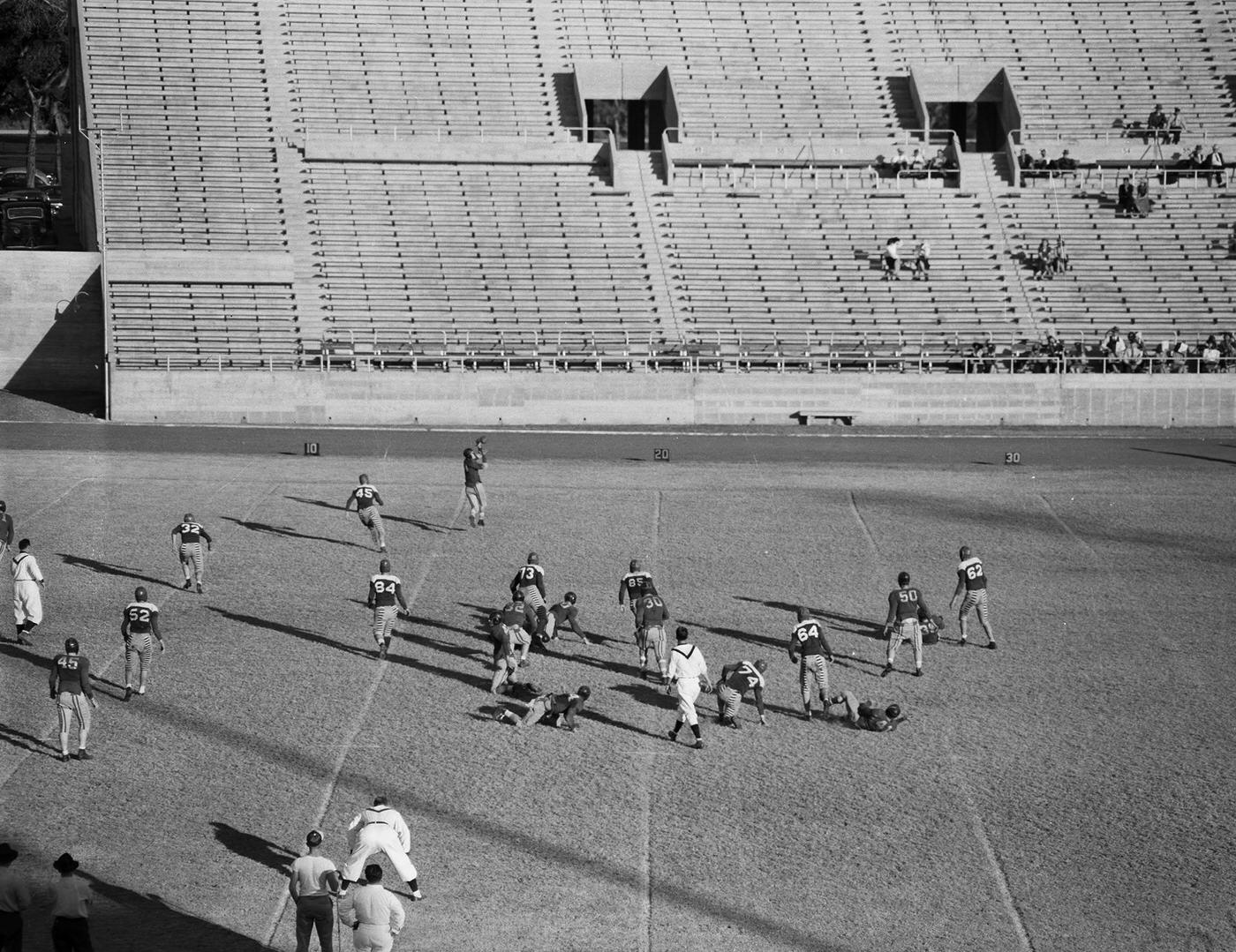 A college football game between Texas Wesleyan College vs. Trinity University is being held at Farrington Field in Fort Worth, Texas, 1941