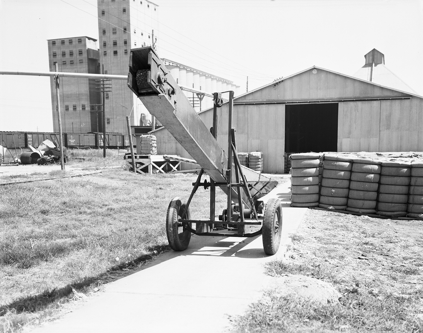 Farm elevator and equipment outside the Traders Cotton Oil Mill Co. plant, 1943