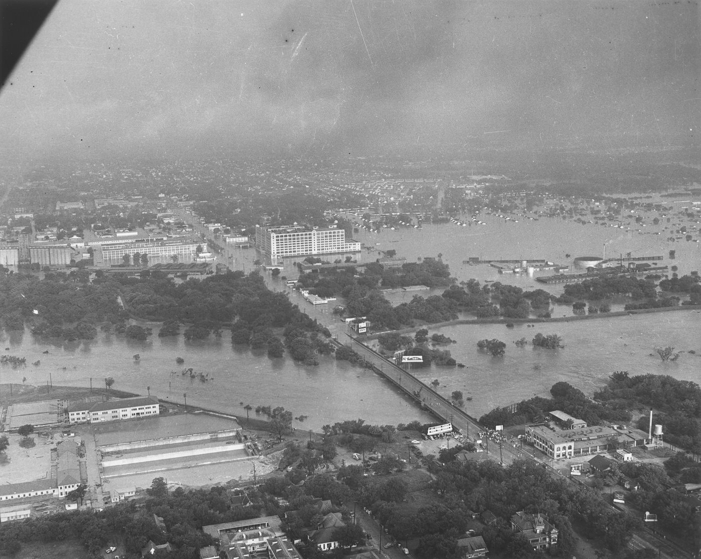 Aerial view of the 1949 flood showing the 7th Street bridge and the Montgomery Ward building, Fort Worth, Texas, 1949