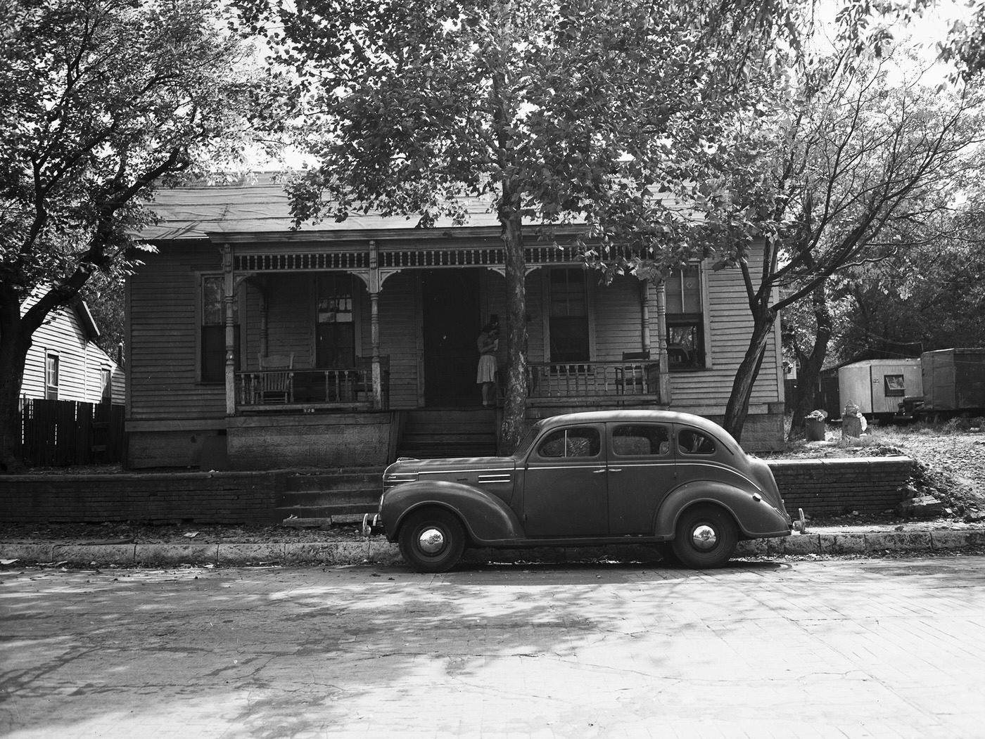 Exterior views of the cottage at 605 West First Street, Fort Worth, Texas owned by Mr. and Mrs. E. H. Keller, 1944