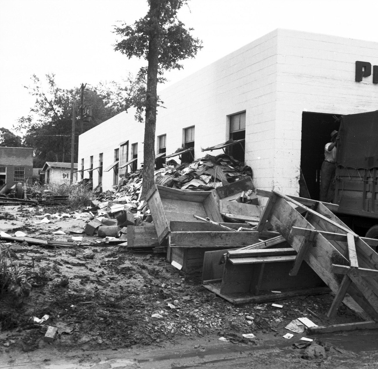 Debris on the side of a building after flood, 1949
