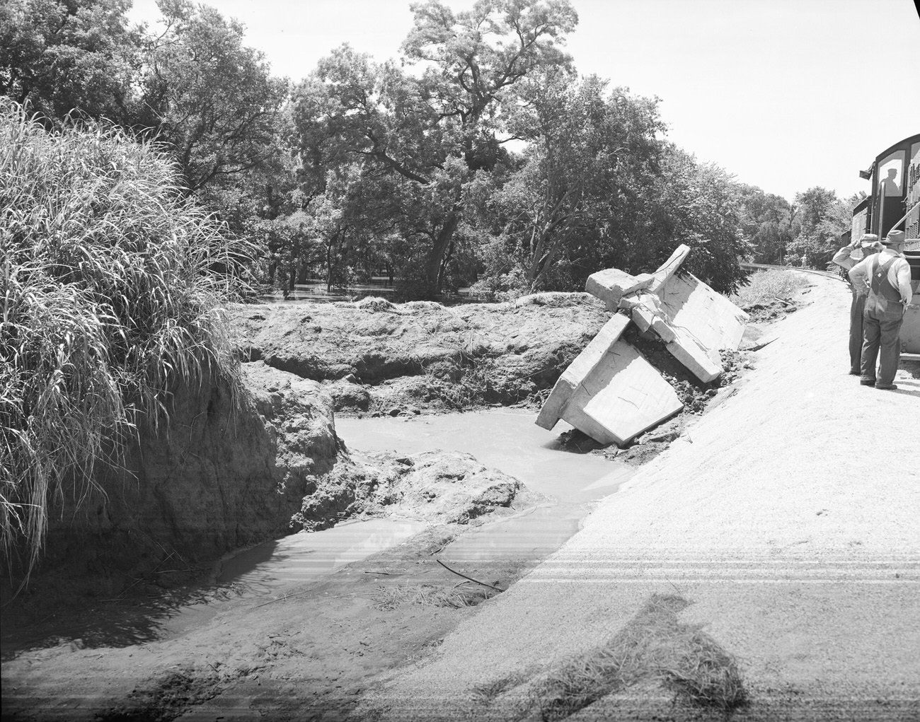 Flood damage looking south, east and across the levees, 1949
