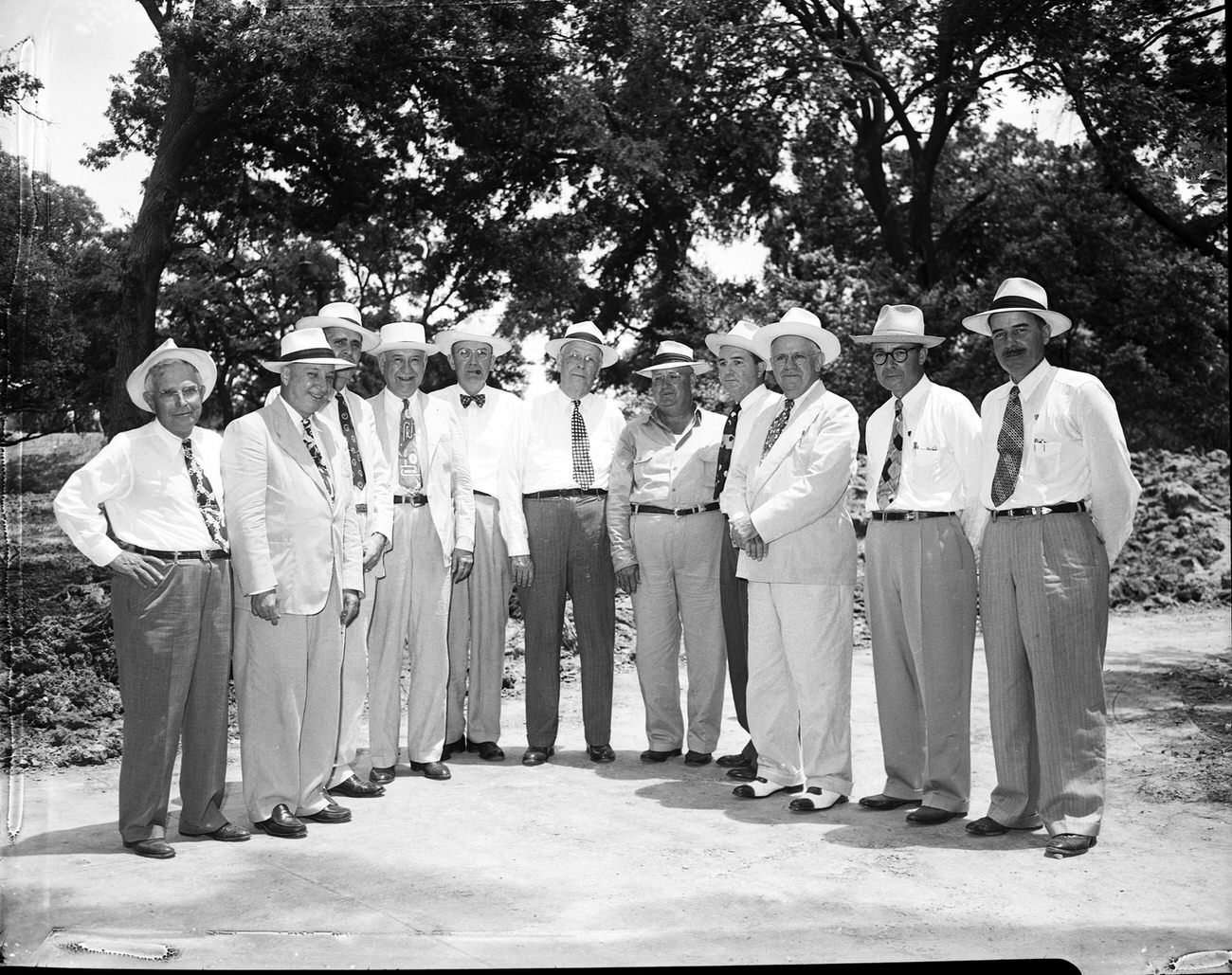 Citizens Flood Control Committee men, along with city and county officials, attending a picnic marking completion of levee repairs.