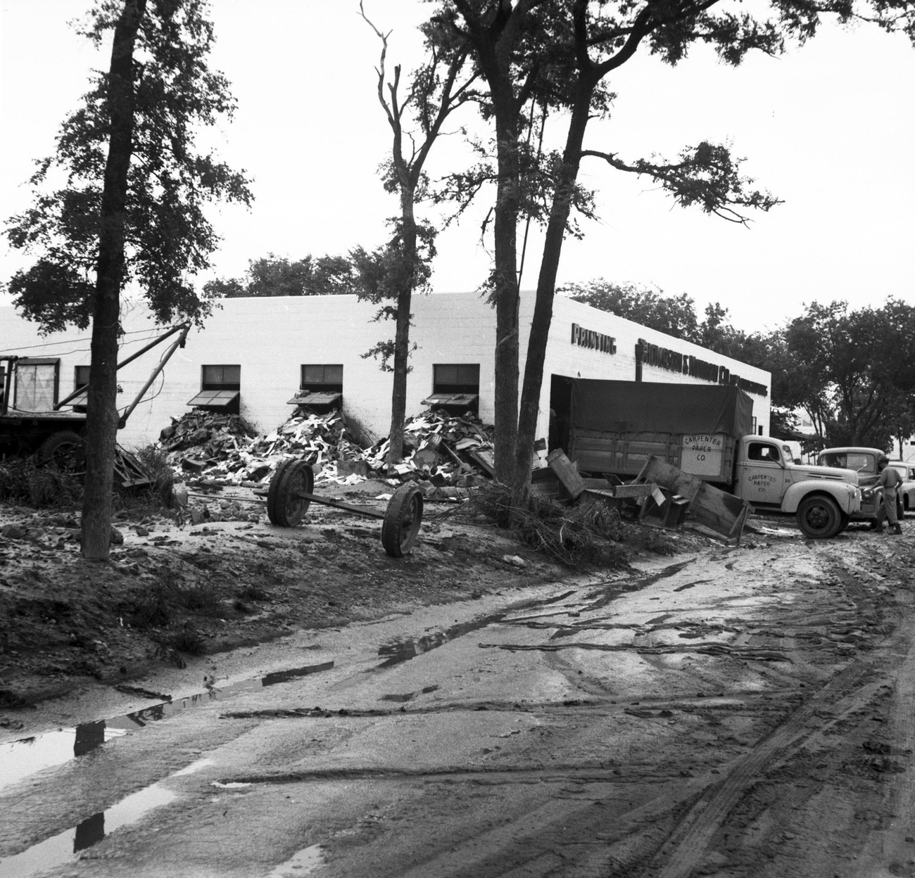 Debris on the side of a building after flood, 1949