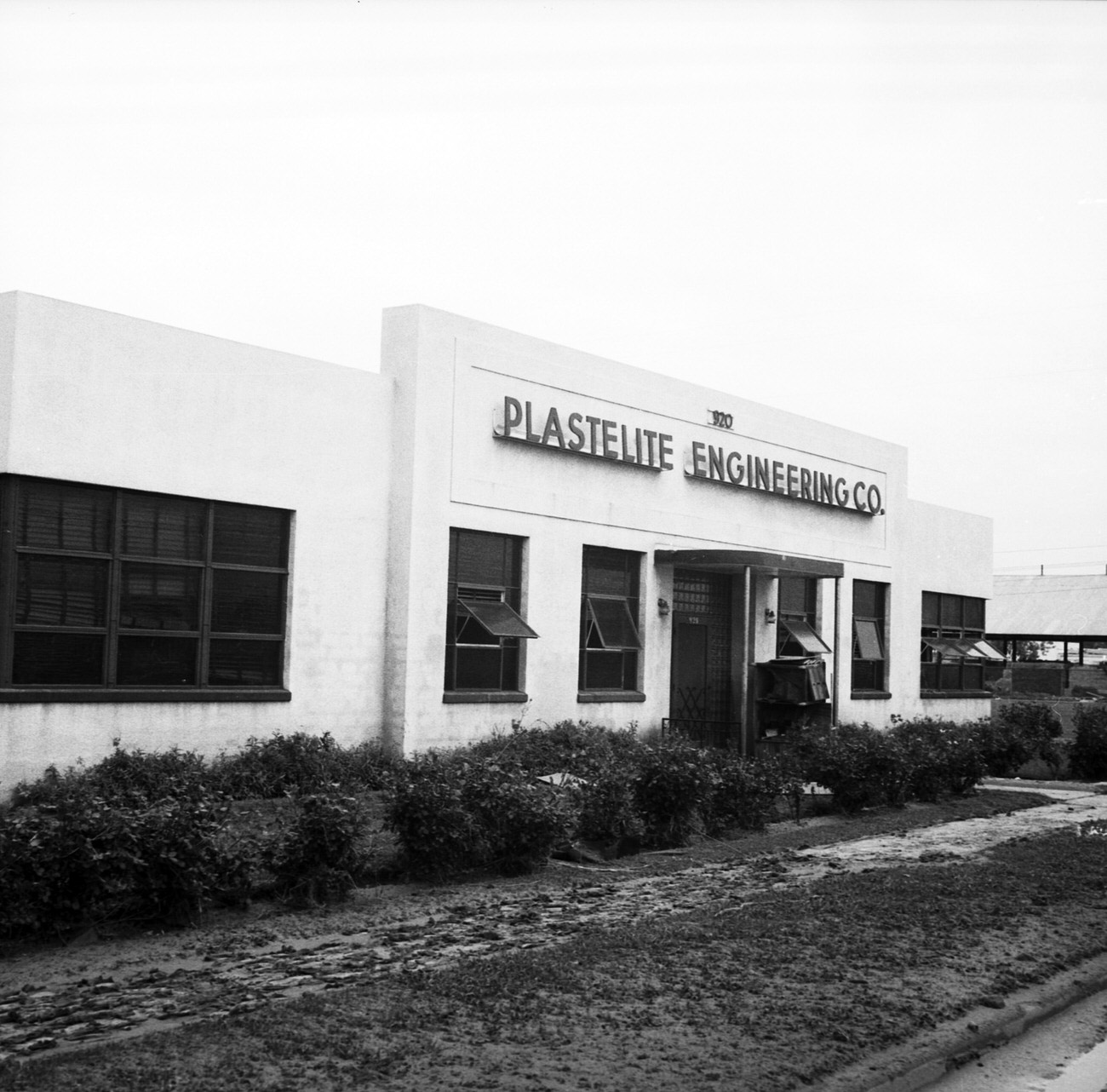 Plastelite Engineering Company building after flood, 1949